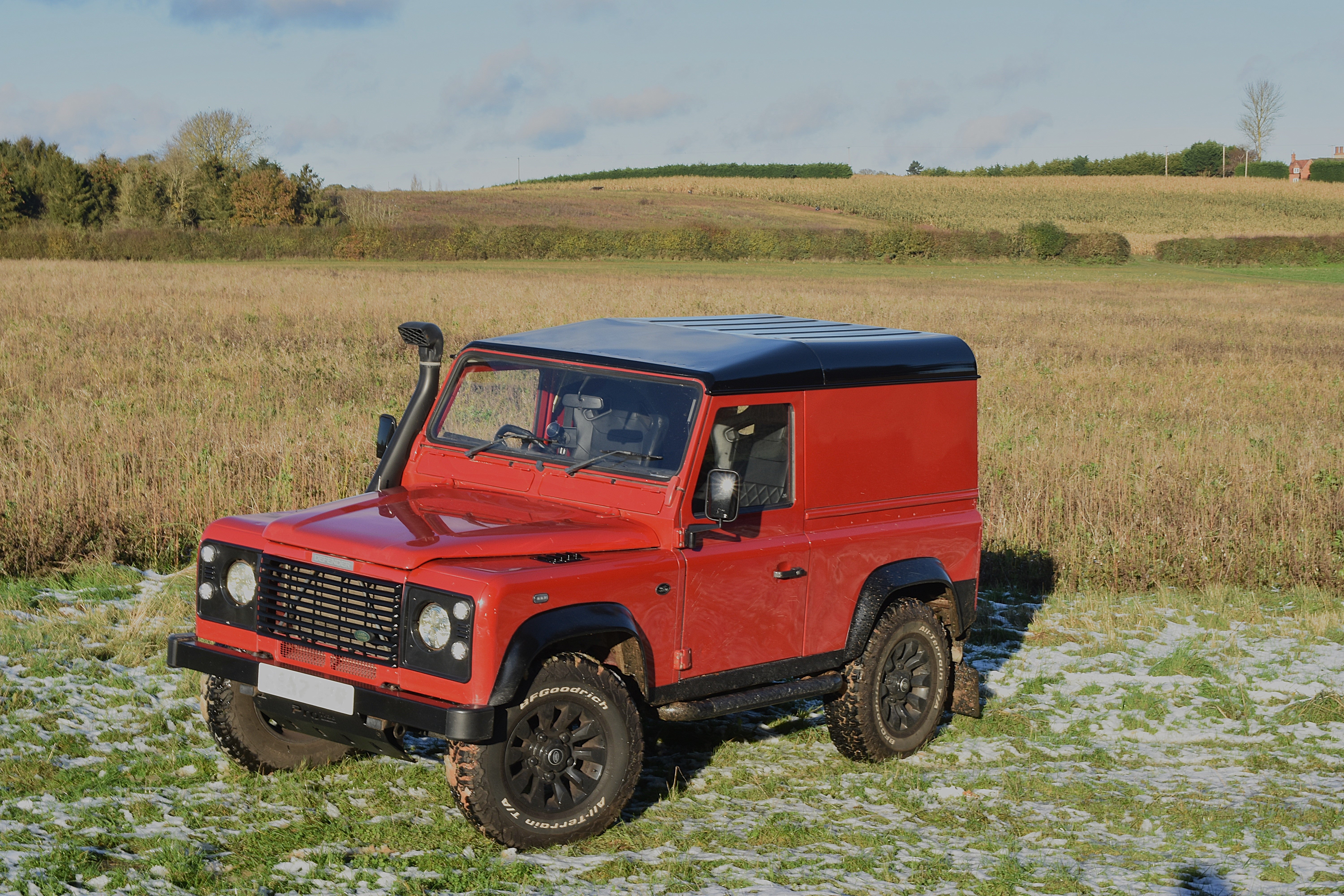 Land Rover Defender 90 in farm field